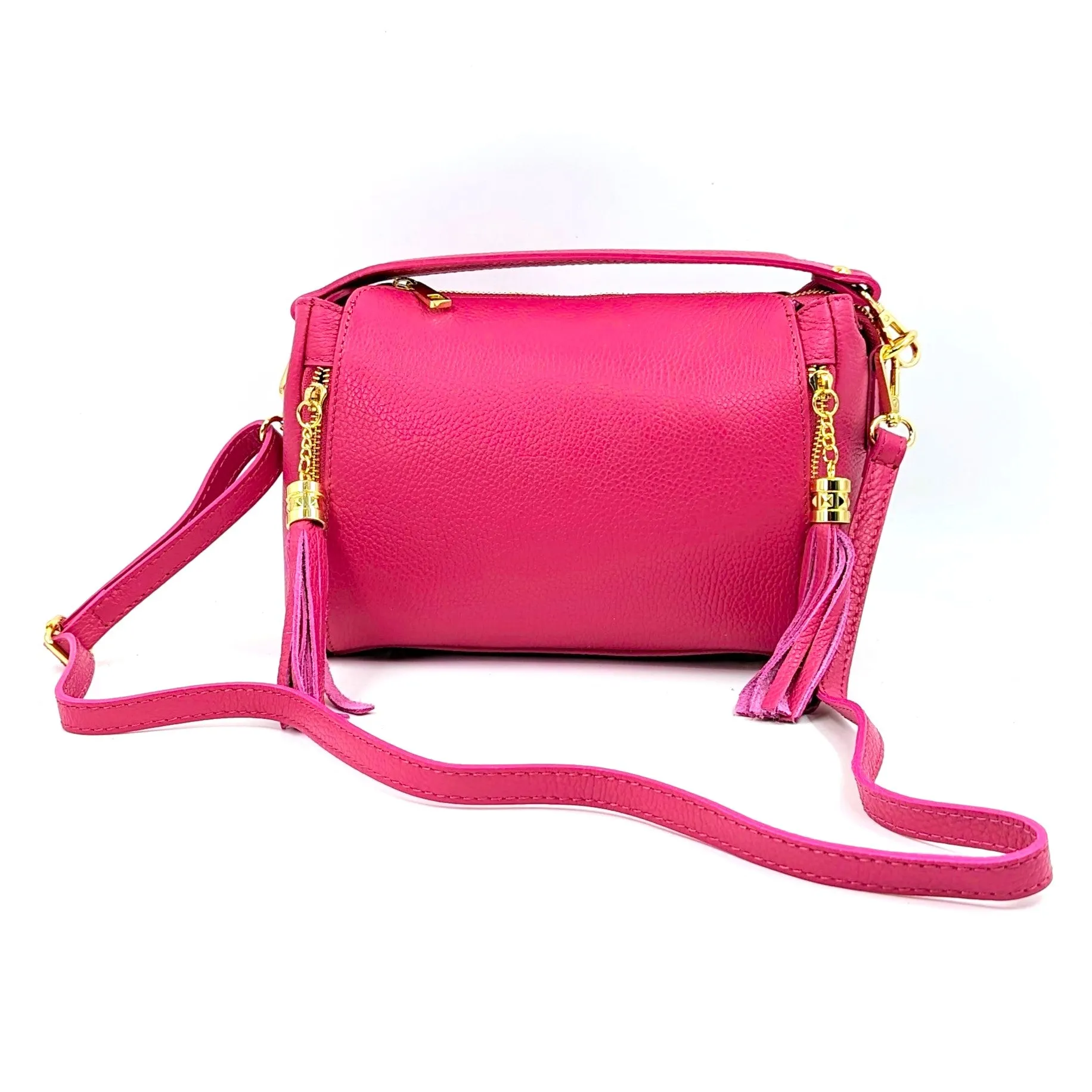 Smallish barrel style leather handbag with tassel elements on sides