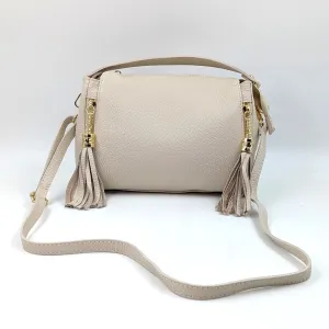 Smallish barrel style leather handbag with tassel elements on sides